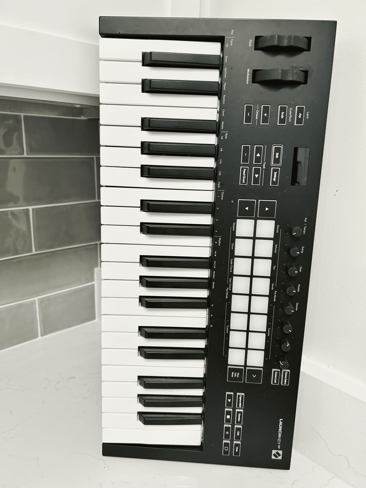 A MIDI keyboard standing on the counter